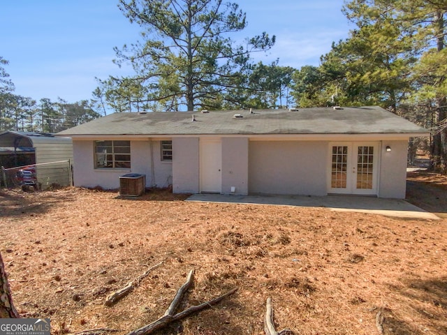 back of house featuring french doors