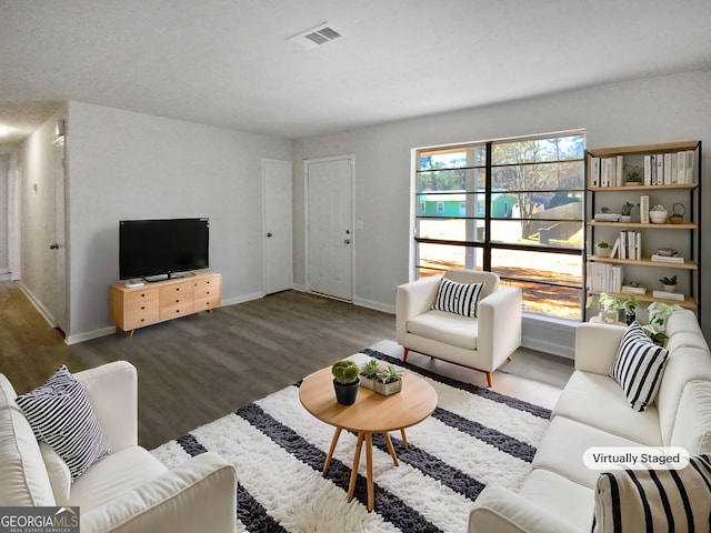 living room featuring dark hardwood / wood-style floors