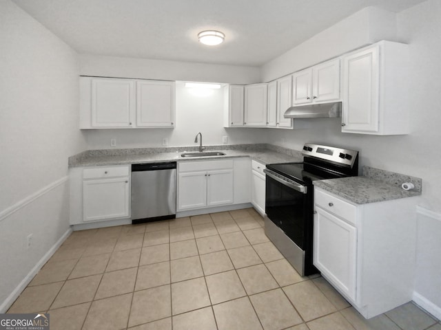 kitchen with sink, stainless steel appliances, white cabinets, and light tile patterned flooring