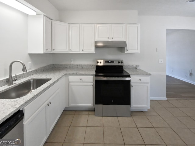 kitchen featuring white cabinetry, appliances with stainless steel finishes, sink, and light tile patterned floors