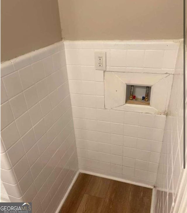 laundry room with washer hookup and dark hardwood / wood-style flooring