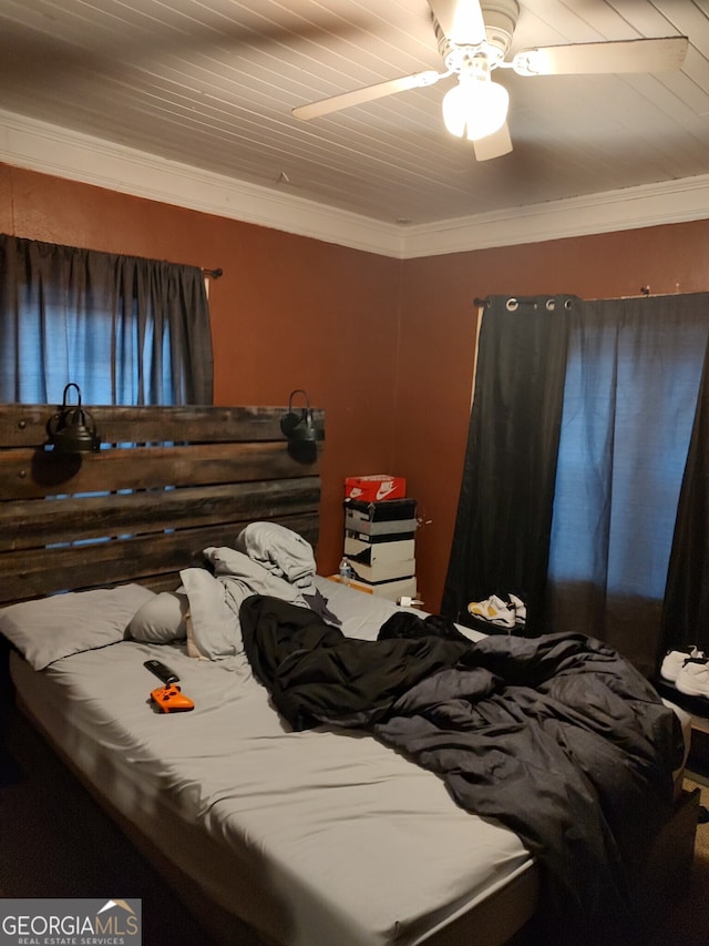 bedroom featuring crown molding and ceiling fan