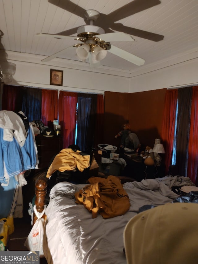 bedroom featuring wood ceiling and ceiling fan