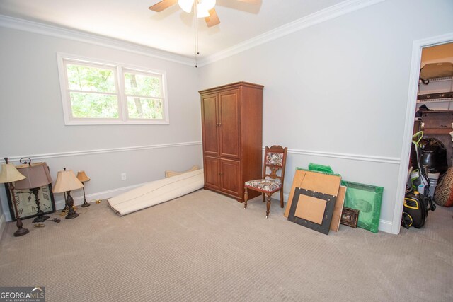 misc room with crown molding, light colored carpet, and ceiling fan