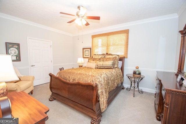 bedroom featuring light carpet, crown molding, and ceiling fan