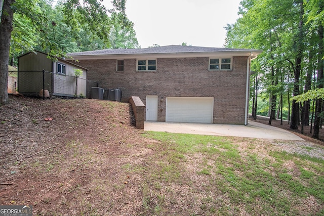 108 Stonebridge Ln, Lagrange, GA 30240 - back of property with an attached garage, brick siding, and driveway