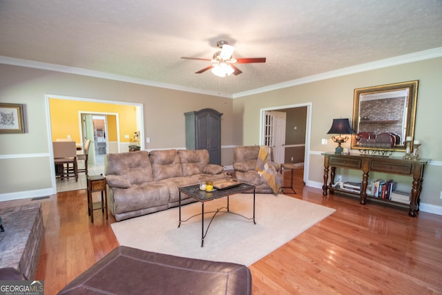 108 Stonebridge Ln, Lagrange, GA 30240 - living room featuring a ceiling fan, wood finished floors, and ornamental molding