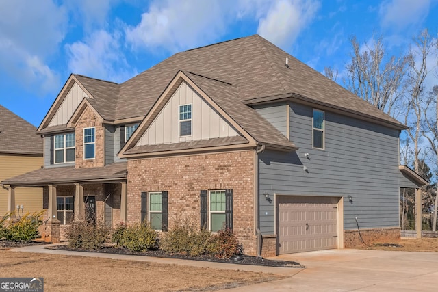 view of front of house featuring a garage and covered porch