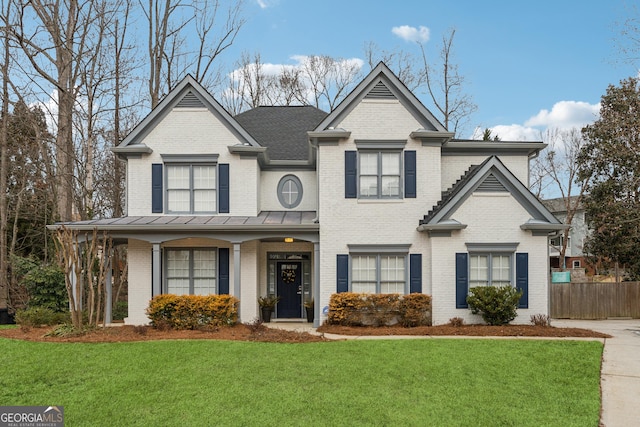 view of front facade featuring a front lawn and a porch