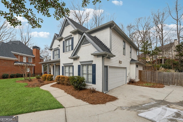 view of front of home with a garage and a front yard