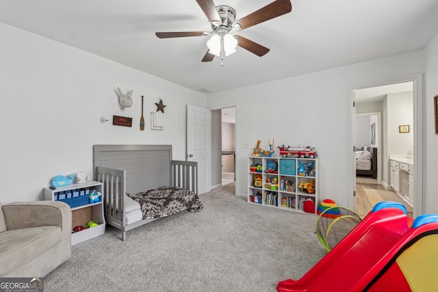 recreation room with light carpet and ceiling fan