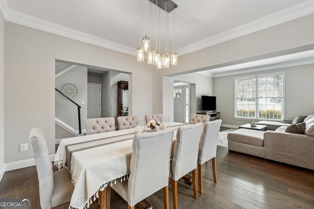 dining space with ornamental molding, dark hardwood / wood-style floors, and an inviting chandelier