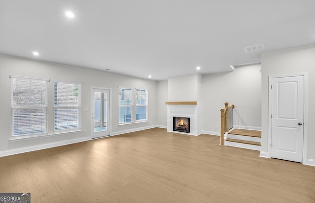 unfurnished living room featuring light wood-type flooring