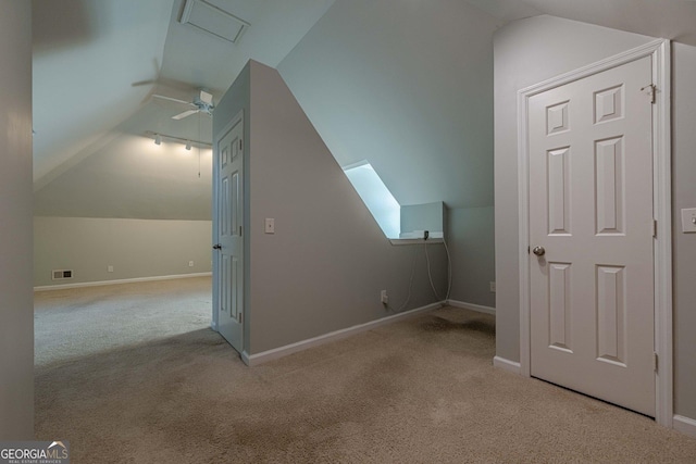 additional living space with lofted ceiling, light colored carpet, and ceiling fan