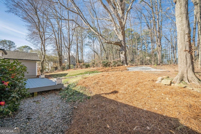 view of yard with a wooden deck