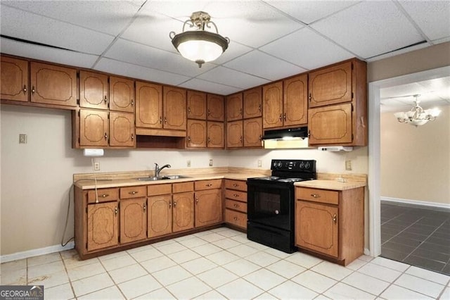 kitchen with a paneled ceiling, black range with electric stovetop, and sink