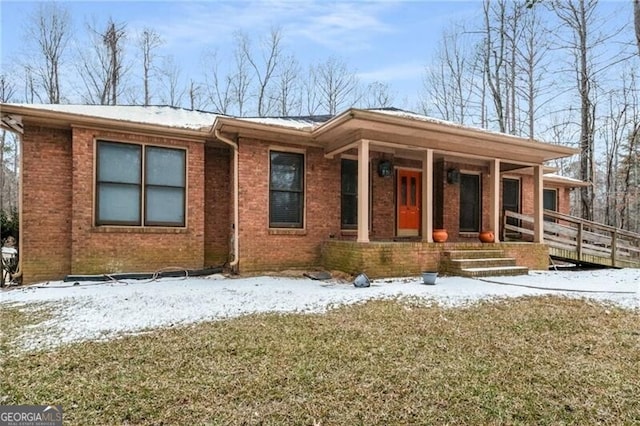 view of front facade featuring a porch and a lawn