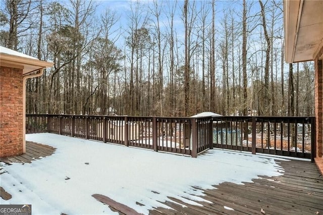 view of snow covered deck