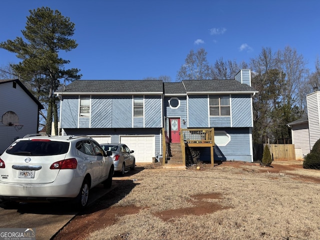 bi-level home featuring a garage