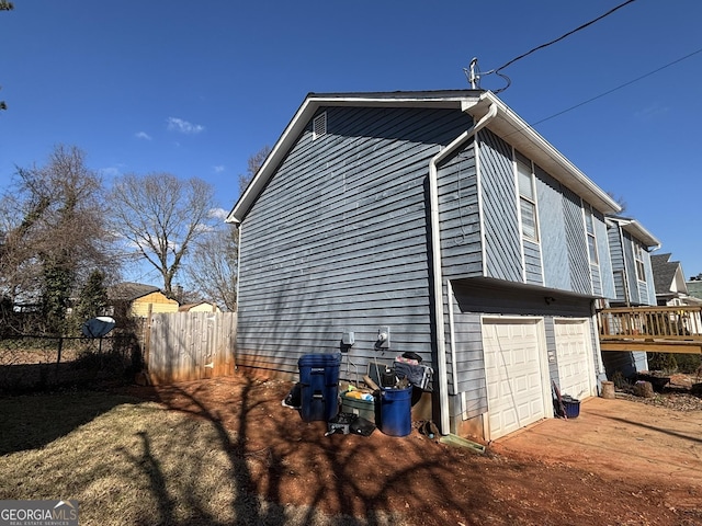 view of property exterior with a garage