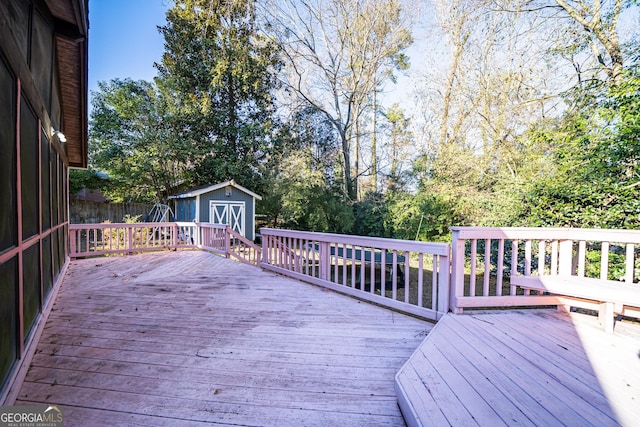 wooden terrace featuring a storage unit