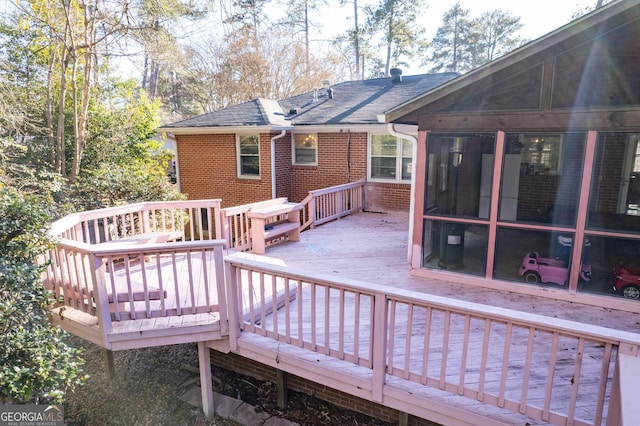 wooden terrace with a sunroom