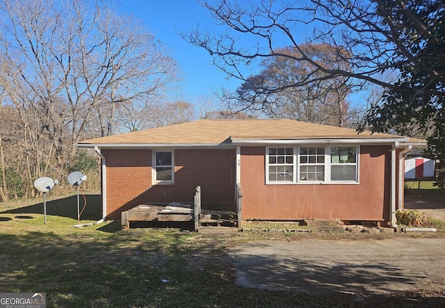 view of home's exterior featuring a yard