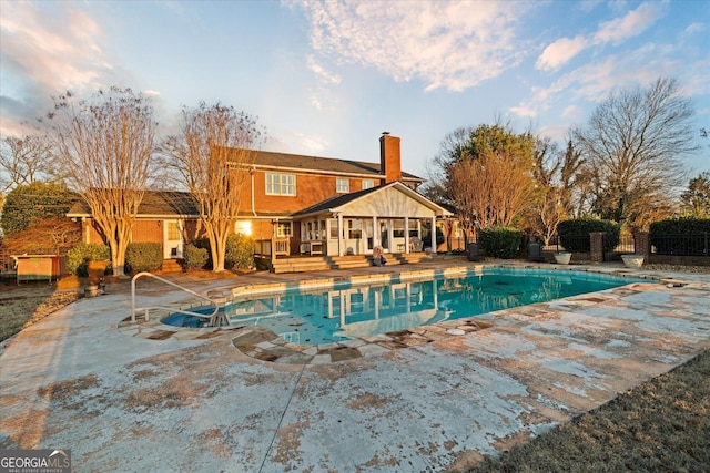 view of swimming pool with a fenced in pool, a patio area, and fence