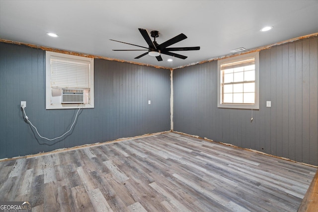 spare room with ceiling fan, cooling unit, recessed lighting, wood finished floors, and visible vents