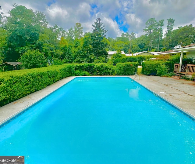 pool with a patio area