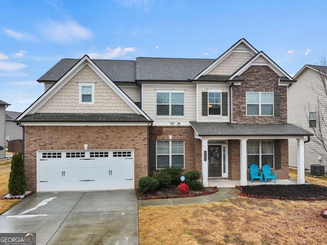 craftsman-style house with a garage, central AC, and a porch