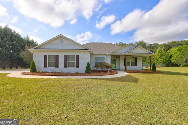 ranch-style home featuring a porch and a front yard