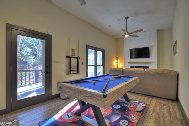 playroom featuring billiards, vaulted ceiling, light hardwood / wood-style floors, and a healthy amount of sunlight