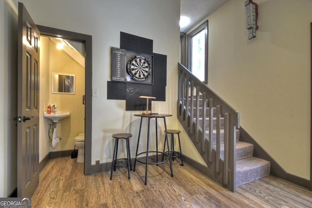 stairs with hardwood / wood-style floors