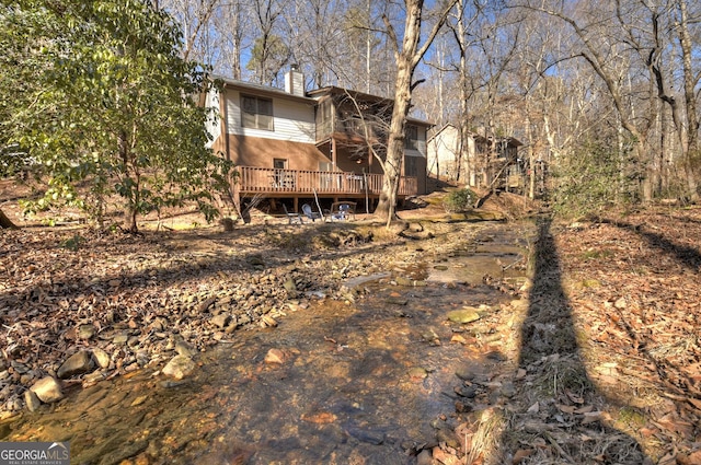 back of house featuring a deck