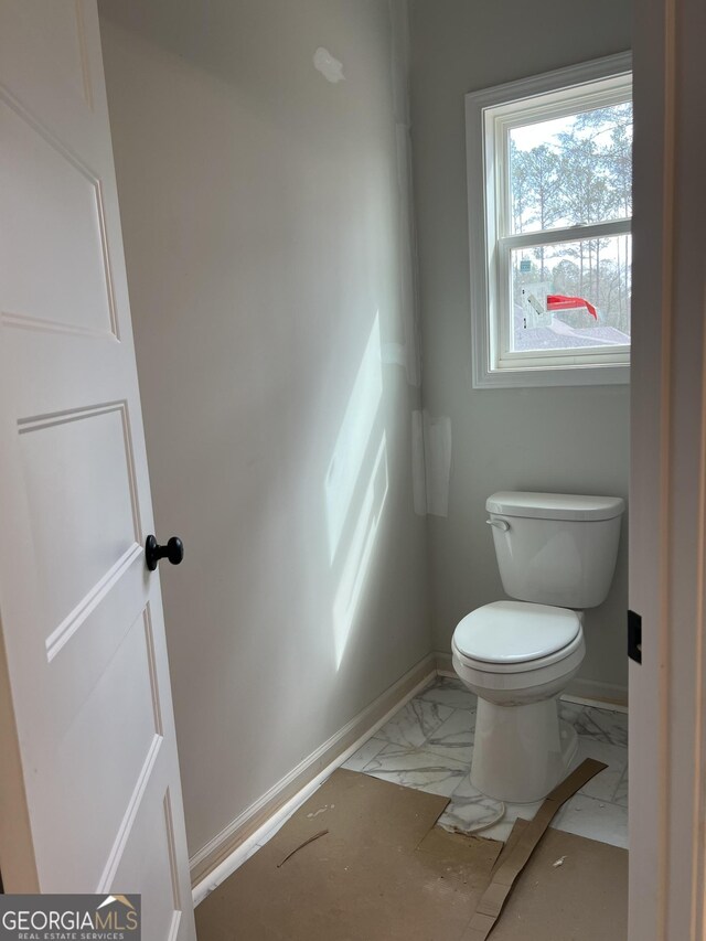 unfurnished room featuring lofted ceiling