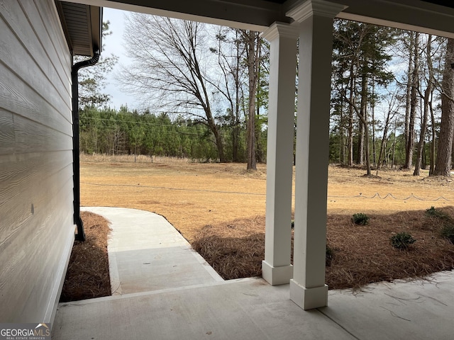 view of yard with covered porch