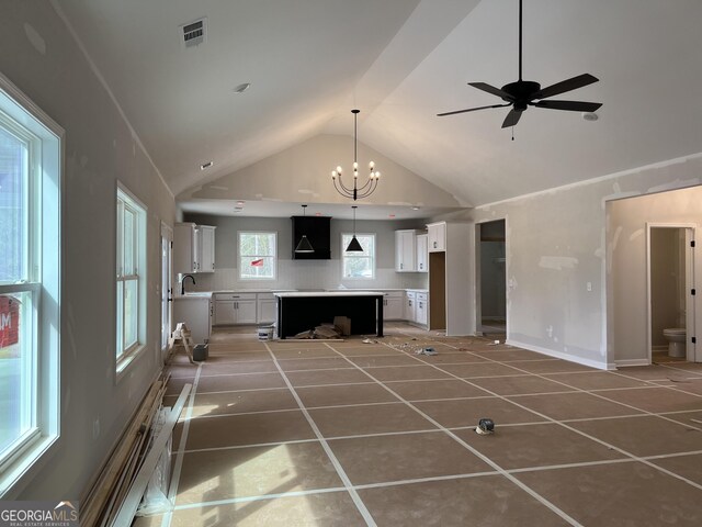 unfurnished living room featuring french doors, high vaulted ceiling, and a wealth of natural light