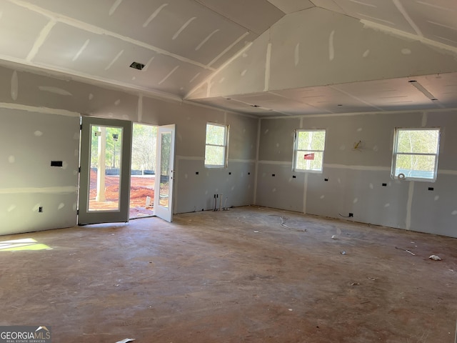 spare room with lofted ceiling