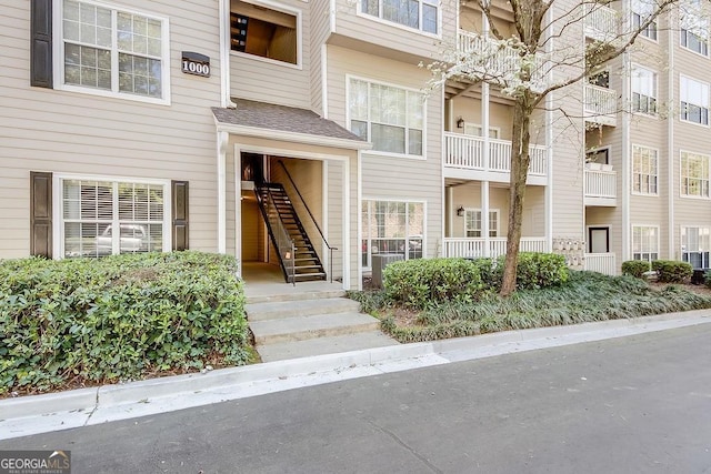 view of property featuring stairs