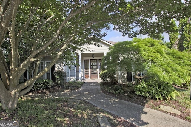 view of property hidden behind natural elements