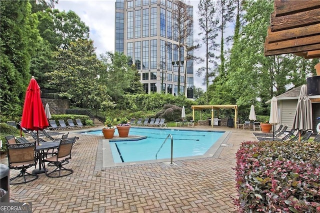 community pool featuring a patio area