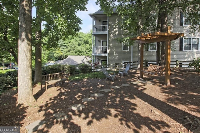 back of house with a balcony