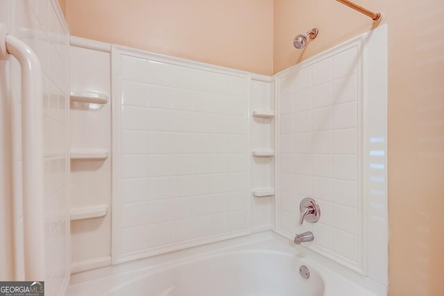 bathroom with bathing tub / shower combination