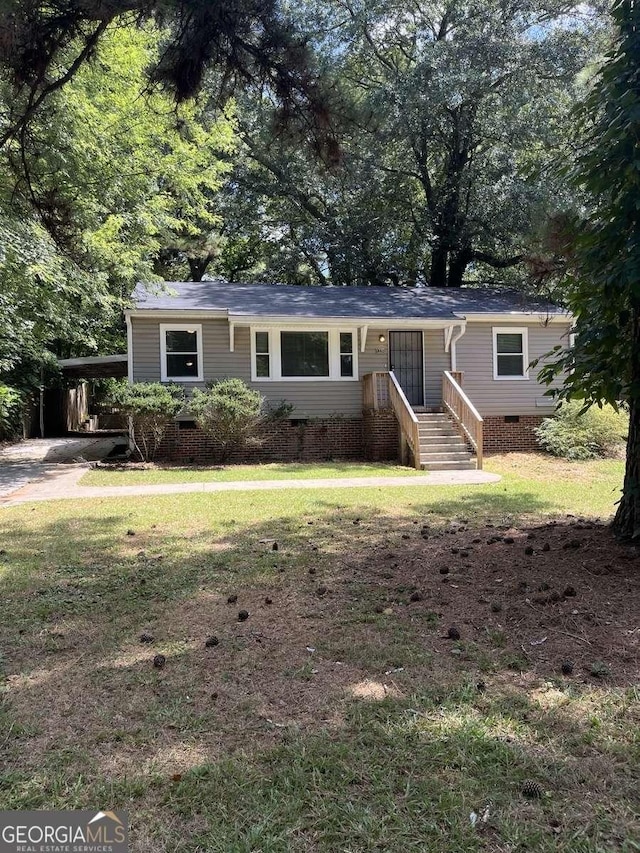 single story home with a carport and a front lawn