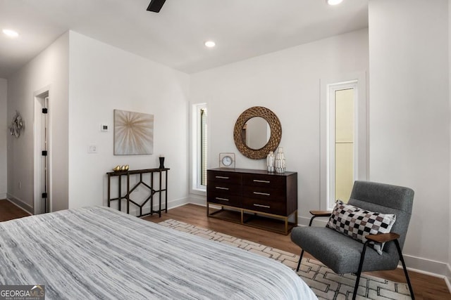 bedroom featuring hardwood / wood-style flooring and ceiling fan