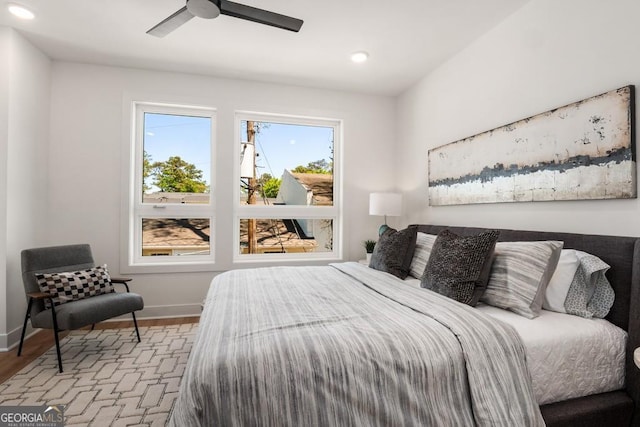 bedroom featuring ceiling fan and light hardwood / wood-style flooring