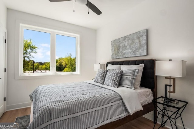 bedroom featuring ceiling fan and hardwood / wood-style floors