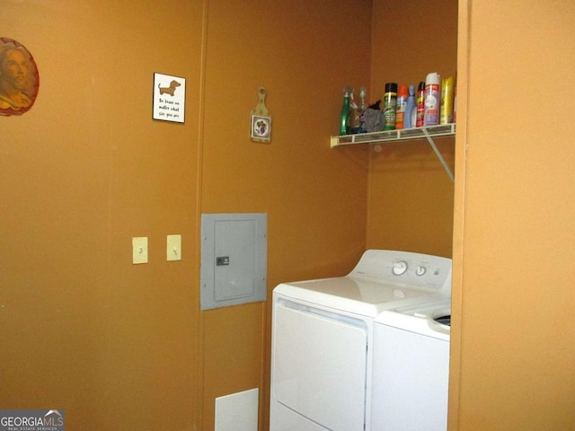 laundry room with separate washer and dryer and electric panel