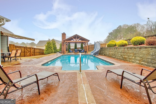 view of pool with a gazebo and a water slide